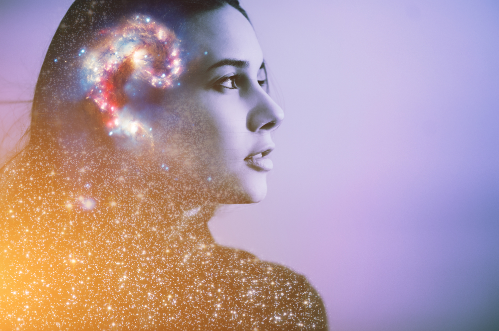 Double multiply exposure abstract portrait of a dreamer cute young woman face with galaxy universe space inside head. Spirit cosmos astronomy life zen concept Elements of this image furnished by NASA